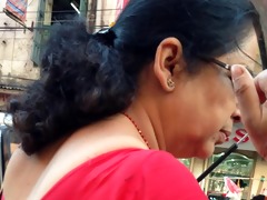 hot aunty with large love bubbles in market